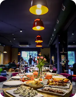A dining table set with Indian dishes